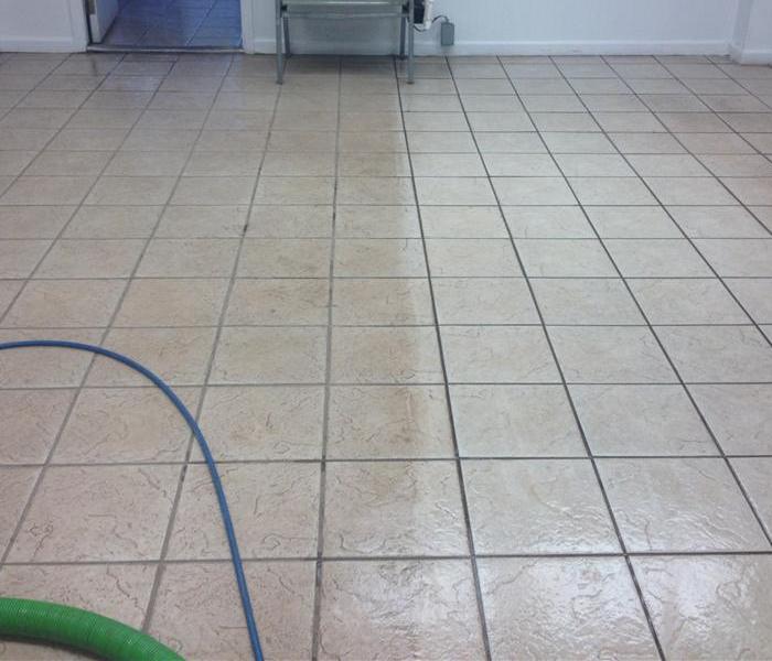 a picture of half dirty and half clean tile
