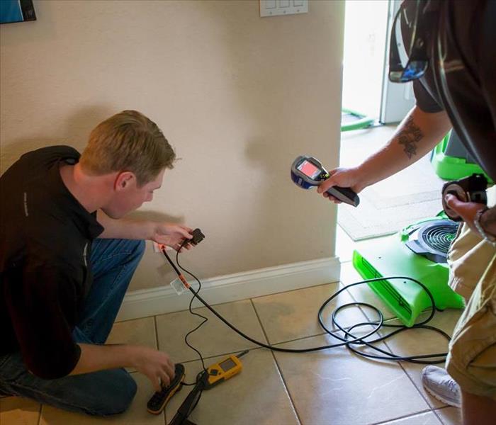 SERVPRO techs checking for moisture in a Lakeland, FL home