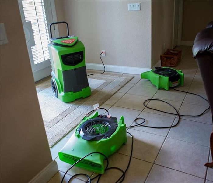 Drying equipment setup in the front hall of a Lakeland, FL home