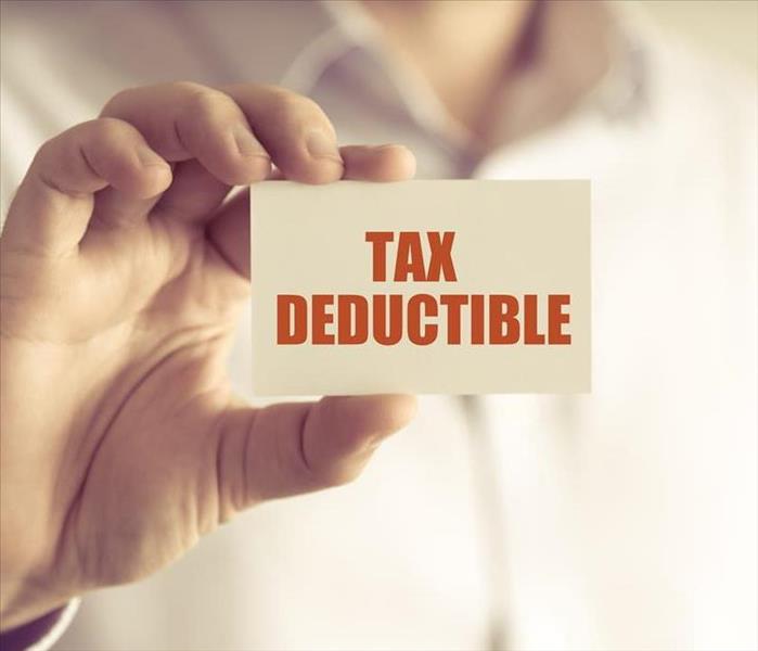 A person with a label that says: Tax deductible